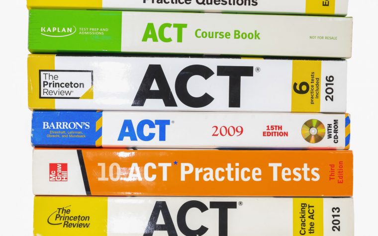 South Lyon, Michigan -December 29, 2022 : Stack of ACT books contain standardized practice tests for university admissions in USA.